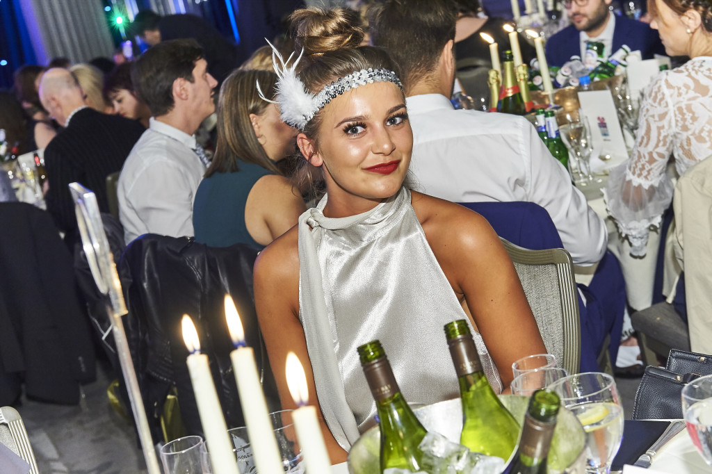 Above: A glamorous guest gets into The ‘Greats’ Gatsby mood with an eye-catching headband.
