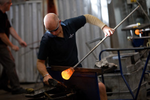 Above: A skilled craftsman at work in the Dartington factory.