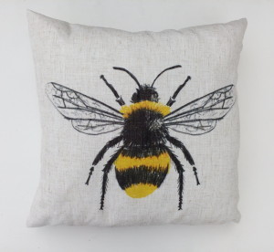 Above: A cushion from Evan Lichfield featuring a trendy bumble bee design.