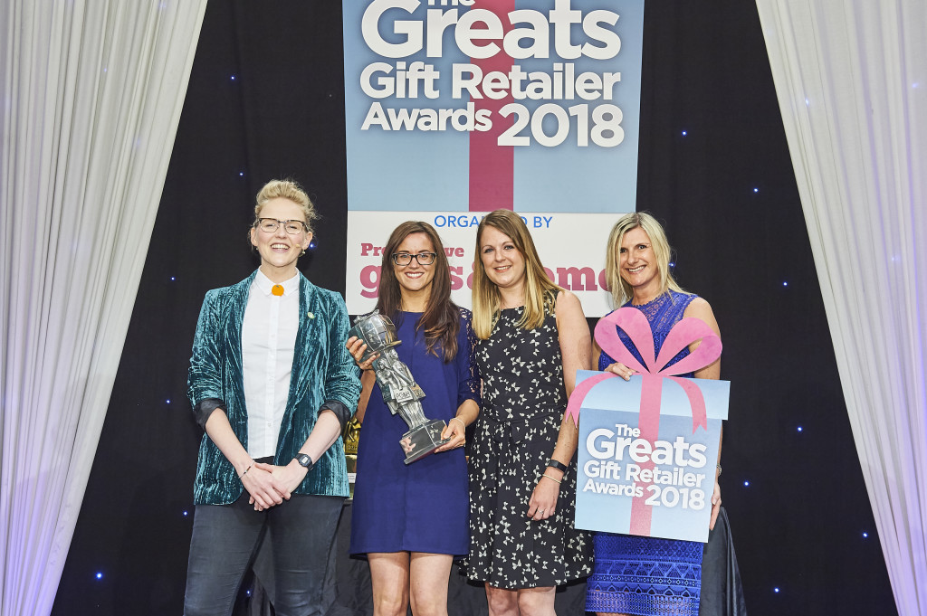 Above: Jennifer Peters, national account manager at Gisela Graham, category sponsor, presented Holly Tyne, shop manageress at The Shop At The Emporium, and Stephanie Hodges, sales assistant, St James’ Place, with the winner’s trophy in the Best In Store/Window display category at The Greats 2018.