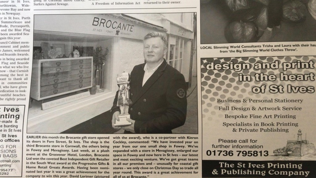 Above: David Lorimer, co-owner of Brocante, is shown proudly holding the shop’s Greats trophy in an article that appeared in the local Cornish media.