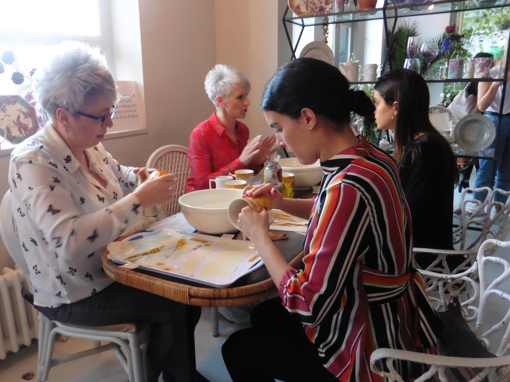 Above: Two of Portmeirion’s lithographers, Gail Barlow (left) and Sam Jepson (far left), showed two visitors how to apply transfers.