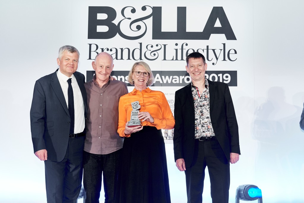 Above:BlissHome’s co-owners Gabrielle and Mike Bliss (second left) collected the B&LLA’s Best Brand Licensed Homewares Product or Range award from Richard Pink, founder of Pink Key Licensing. Also shown is the event’s host, Adrian Chiles.