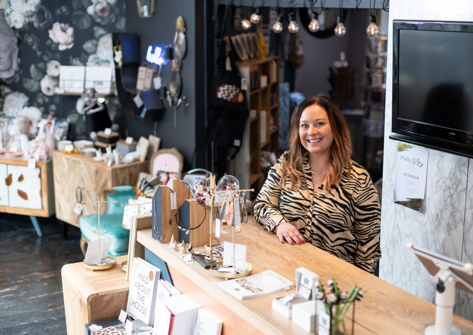 Above: Emma Bustamante, the owner of Cositas, provides retail-tainment for customers.