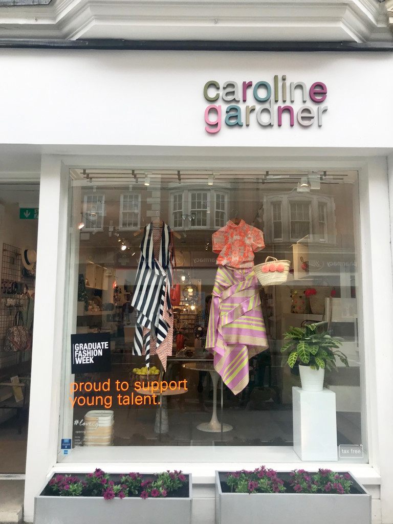 Above: The current window at Caroline Gardner on London’s Marylebone High Street feature the collections of two fashion graduates.