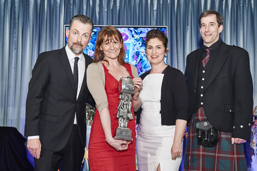 Above: The Old School Beauly’s Helen and William Crawford were presented with a Greats trophy by sponsor Clare Davis, as winners of the Scotland category in 2015. On the left is compere Ben Norris.