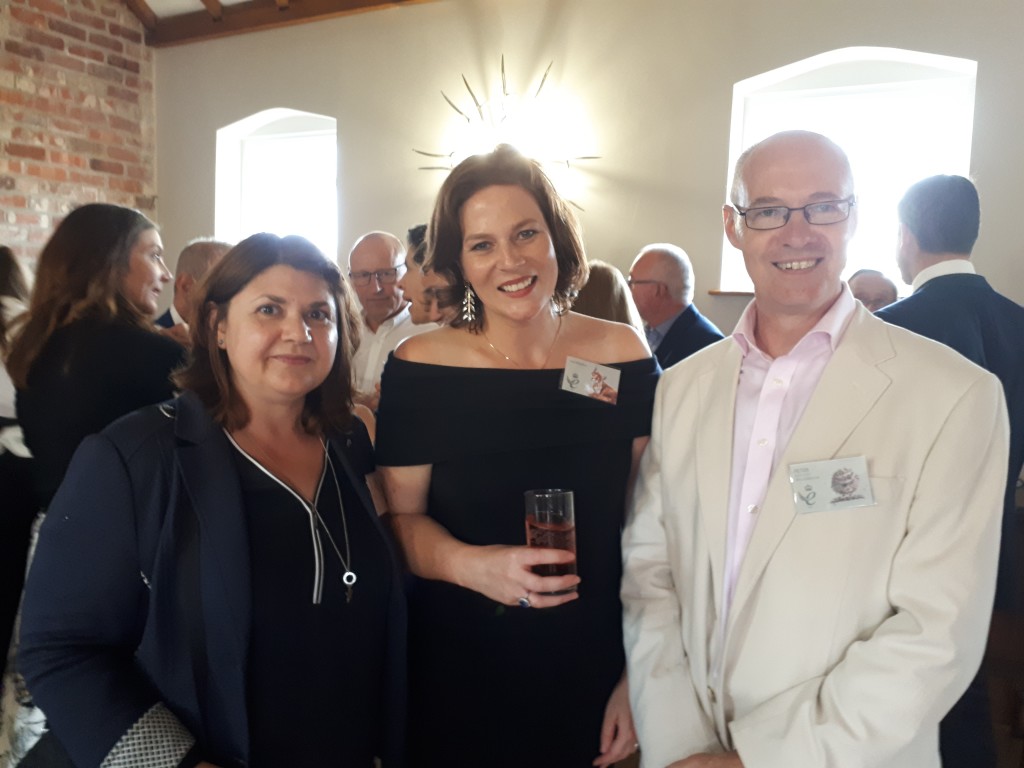 Above: A beaming Hannah is shown with husband and wife Peter and Jelena Whiteman, co-owners of Dzodzo in Woodbridge, a Wrendale Designs’ stockist. 