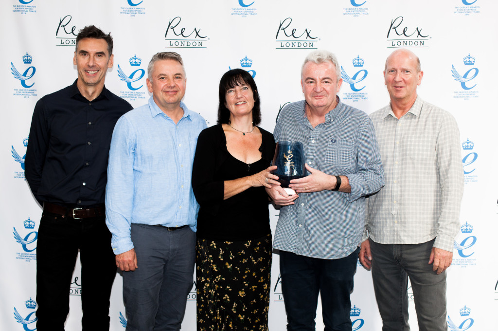 Above: Rex London’s sales director Nigel Biggs, accompanied by the senior management team, is shown with the prestigious Queen’s Award for Enterprise: International Sales.