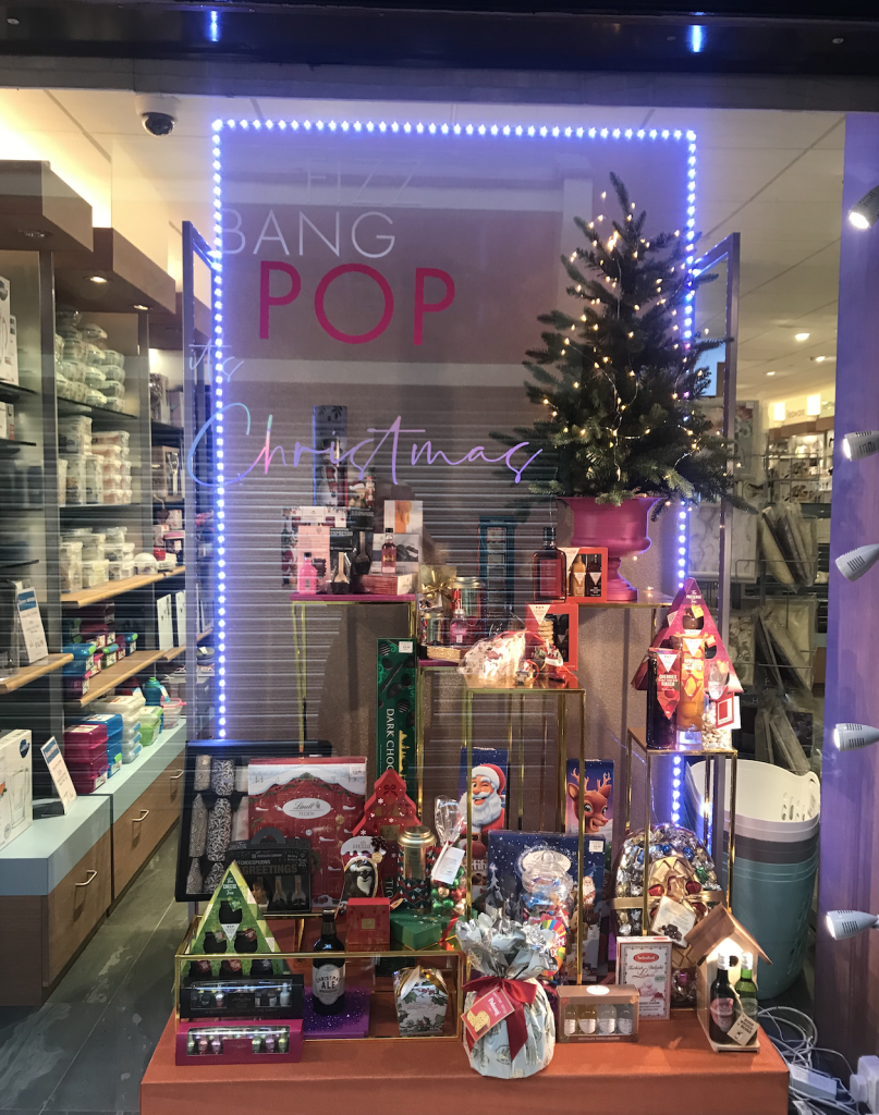 Above: A Christmas window at Barkers, Northallerton, fanfares food gifting.