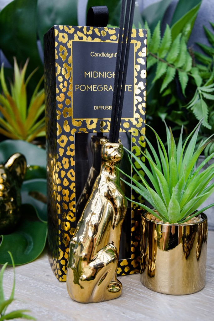 Above: An Animal Luxe reed diffuser from Candlelight features a gold leopard pot.
