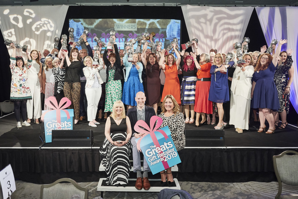 Above: Last year’s Greats winners are shown on stage triumphantly waving their coveted Greats trophies in the air.