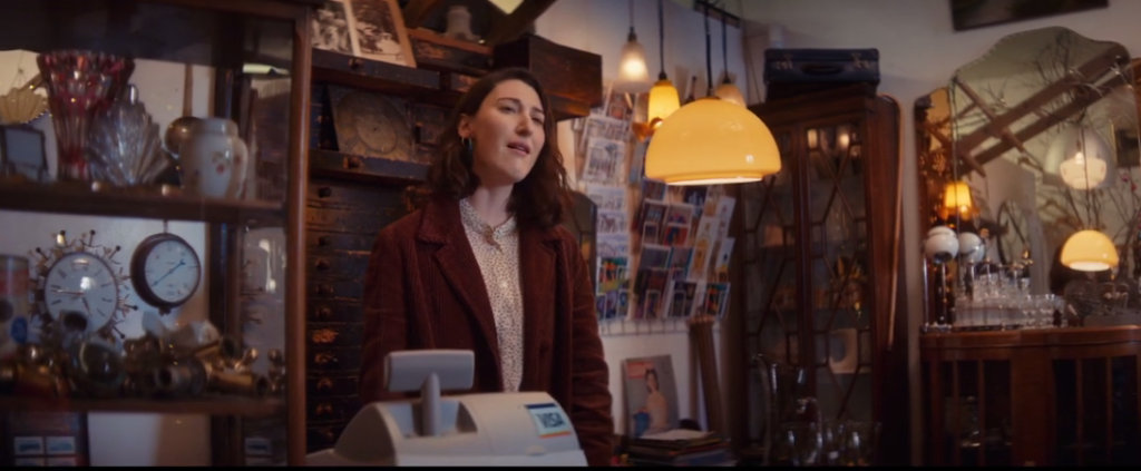 Above: A retailer in the original Visa ad singing along to Queen’s ‘Somebody To Love’.