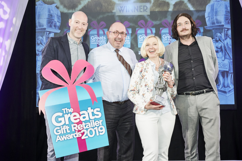 Above: Big smiles from Aga Gabrysiak and Richard Marsden, co-owners of Highworth Emporium in Highworth, winner of The Greats Best Non-Specialist Retailer of Gifts category. The award was presented by Matt Payne, (right), managing director of  Method UK, category sponsors. Also shown is compere Henry Paker.