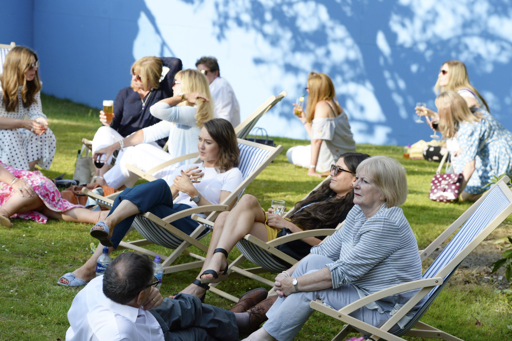 bove: In pre-Covid times, visitors are shown taking time out o relax in the grounds of the DoubleTree Hilton Harrogate