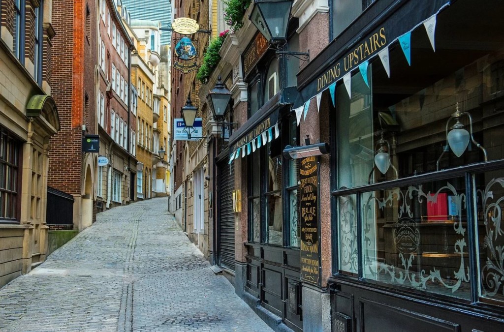 Above: With many people still working from home, the City of London remains deserted.