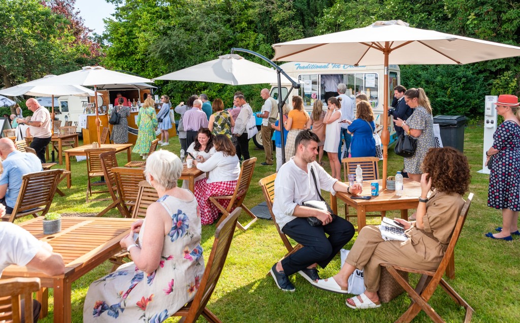 Above: Exhibitors and visitors are shown relaxing at the end of the day.