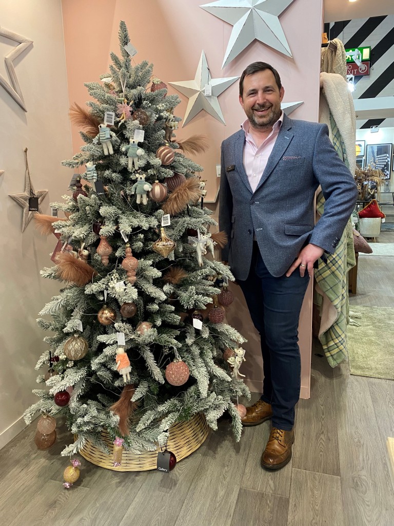 Above: Peter Delaney with one of Gallery’s decorated Christmas trees.