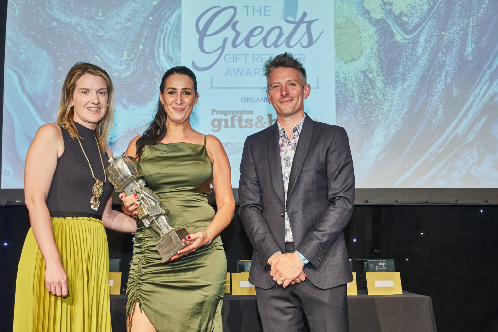 Above: A delighted Sarah Cox accepted the Best Department Store trophy from Helena Riggs, sales and key account manager of category sponsor Ashleigh & Burwood.