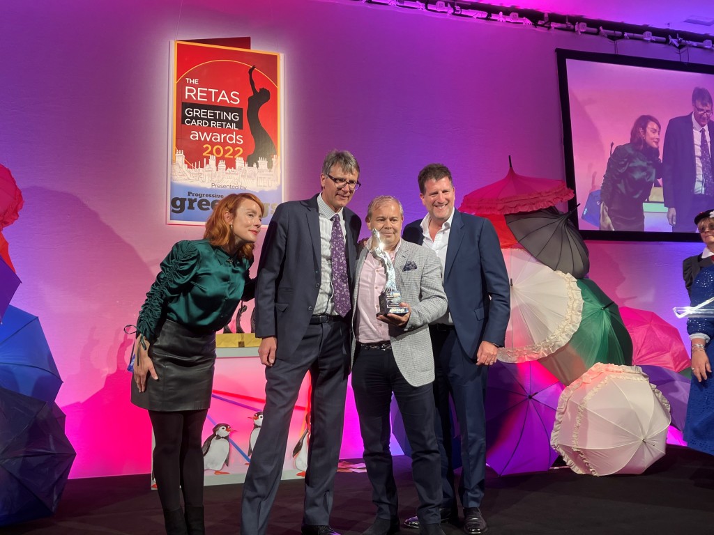 Above: House of Cards’ co-owners Nigel Williamson (centre left) and Miles Robinson (centre right) are shown receiving the Best Greeting Card Small Multiple Award from David Byk (right) ceo of category sponsor Ling Design. On the left is comedian and compere Sara Barron.