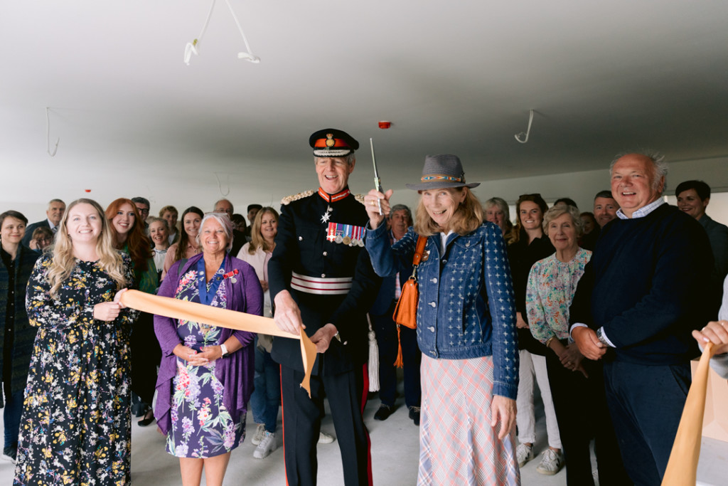 Above: St. Eval’s owner Sarah Young-Jamieson is shown cutting the ribbon at the grand opening.