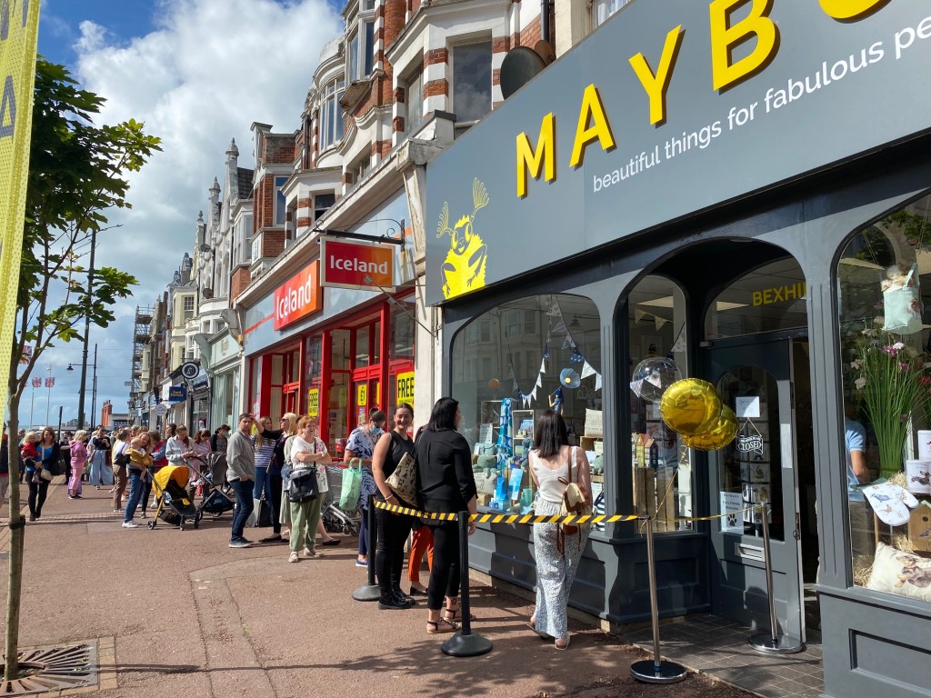 Above: People were queuing to get in an hour before Maybug’s new Bexhill-on-Sea store opened.