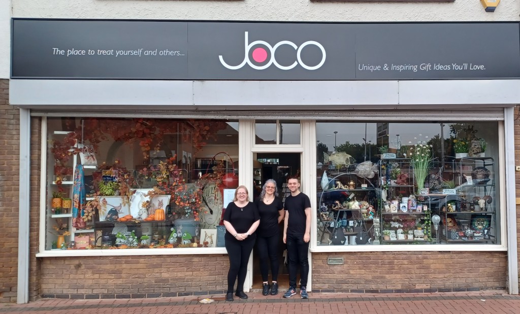 Above: Jo Williams (centre) outside her new store in Nuneaton. Jo is shown with her son Cameron and colleague Fiona Withey.