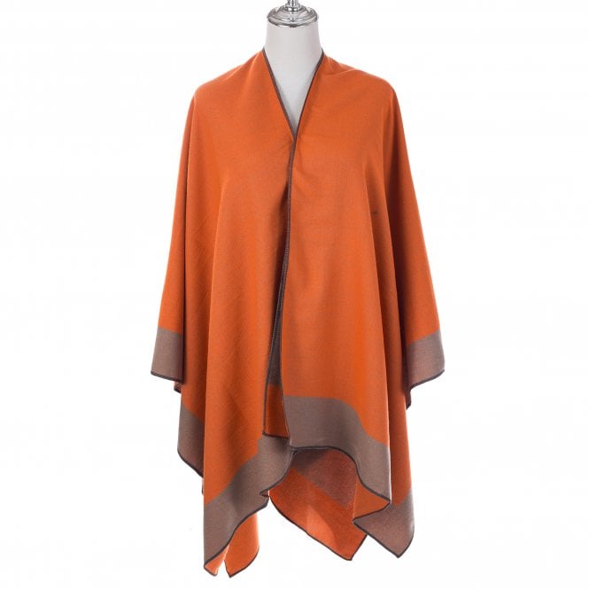 Above: A reversible cinnamon/tan poncho is among this season’s newest fashion accessories from Maybugs.
