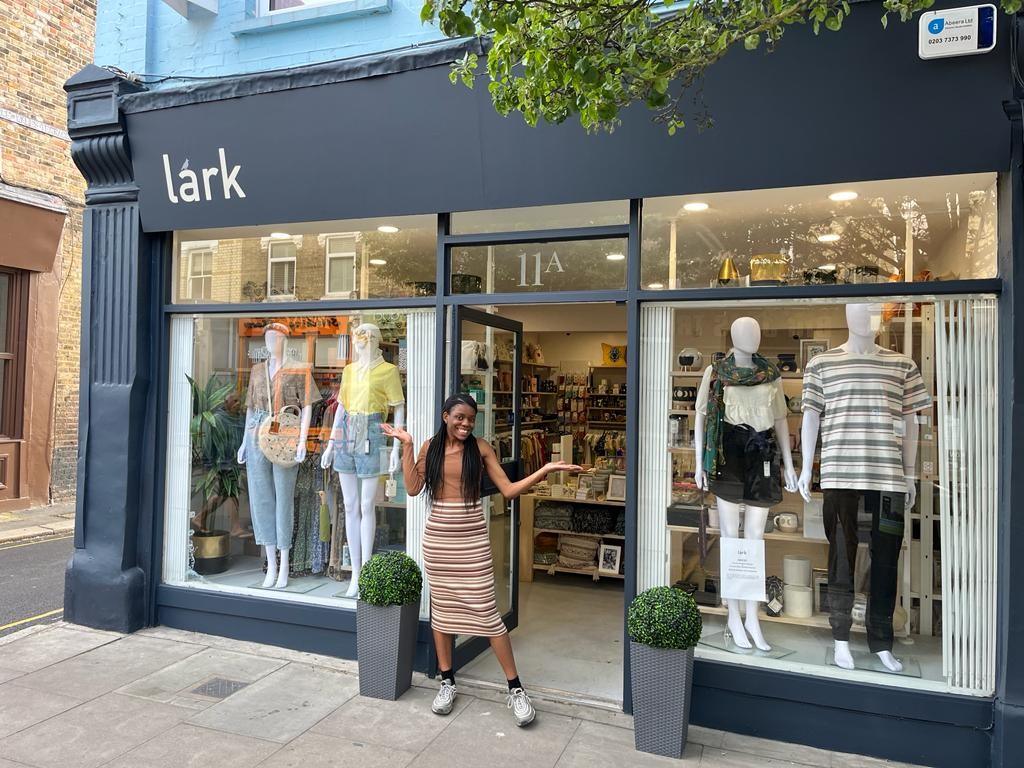 Above: Shop assistant Eunice Boka Nlasa is shown outside the Lark store in Chiswick.