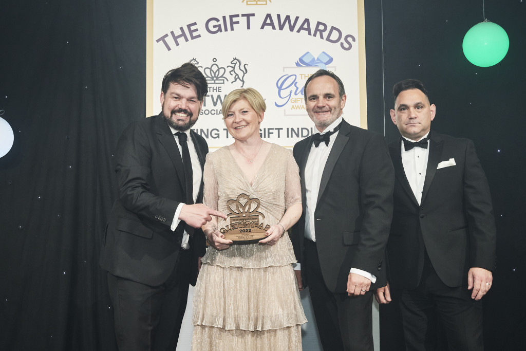 Above: Mike Antwoon, sales director of Yodel, sponsor of the Gift of the Year 2022 Best Design & Craft Product or Range category, presented Julian and Nikki Garner, co-owners of Inside Out Toys, with their GOTY trophy at The Gift Awards in May.