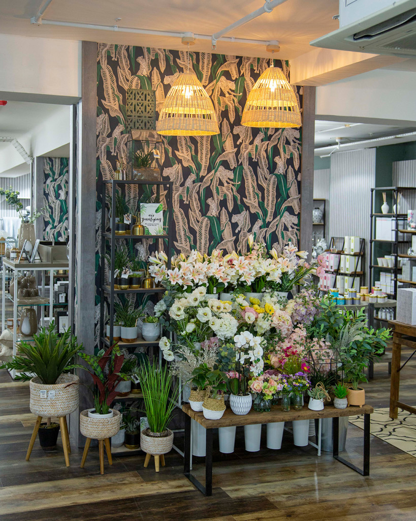 Above: Faux flowers are part of the product mix in the Home department.