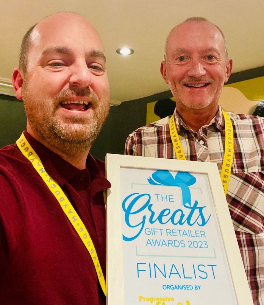 Above: Maybugs’ Greg Rose and John Dale continued to spread the word yesterday with a framed print out of The Greats Finalist logo which they displayed in their shops.