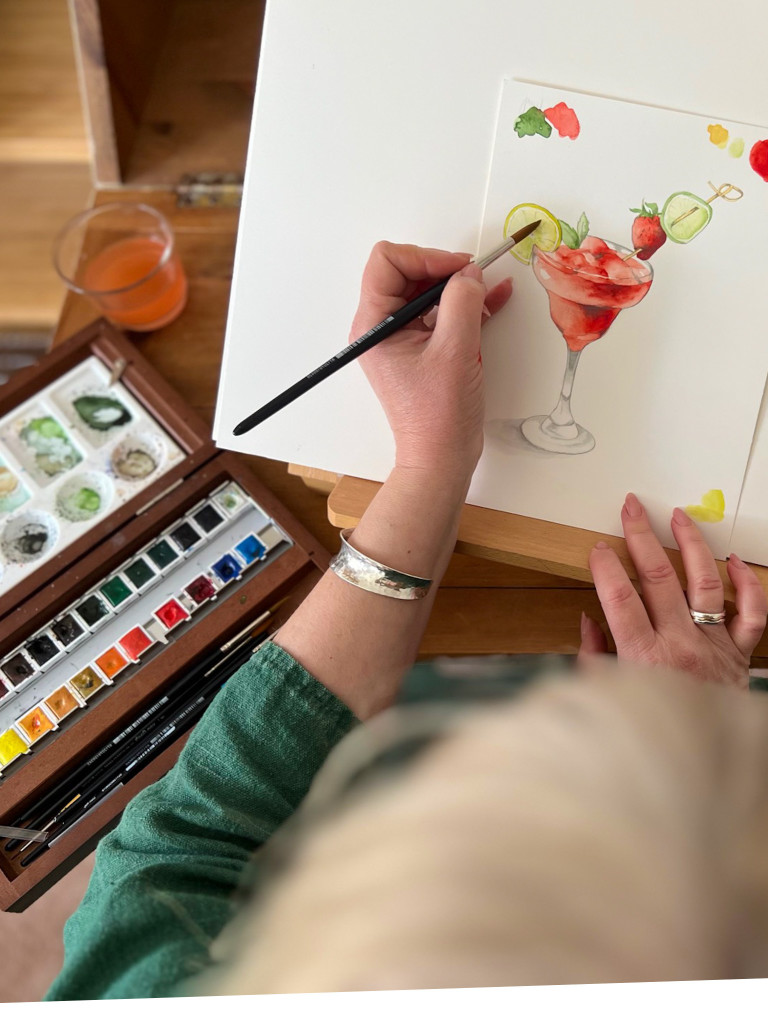 Above: Crumble & Core’s watercolour artist Jilly Mercer Pont at work creating The Greats Awards ticket design.