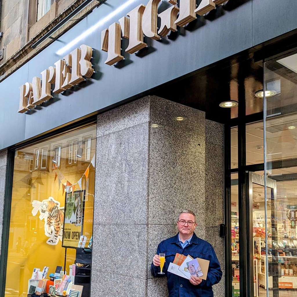 Top: Michael Apter celebrating the opening of his third Paper Tiger store with a glass of fizz.