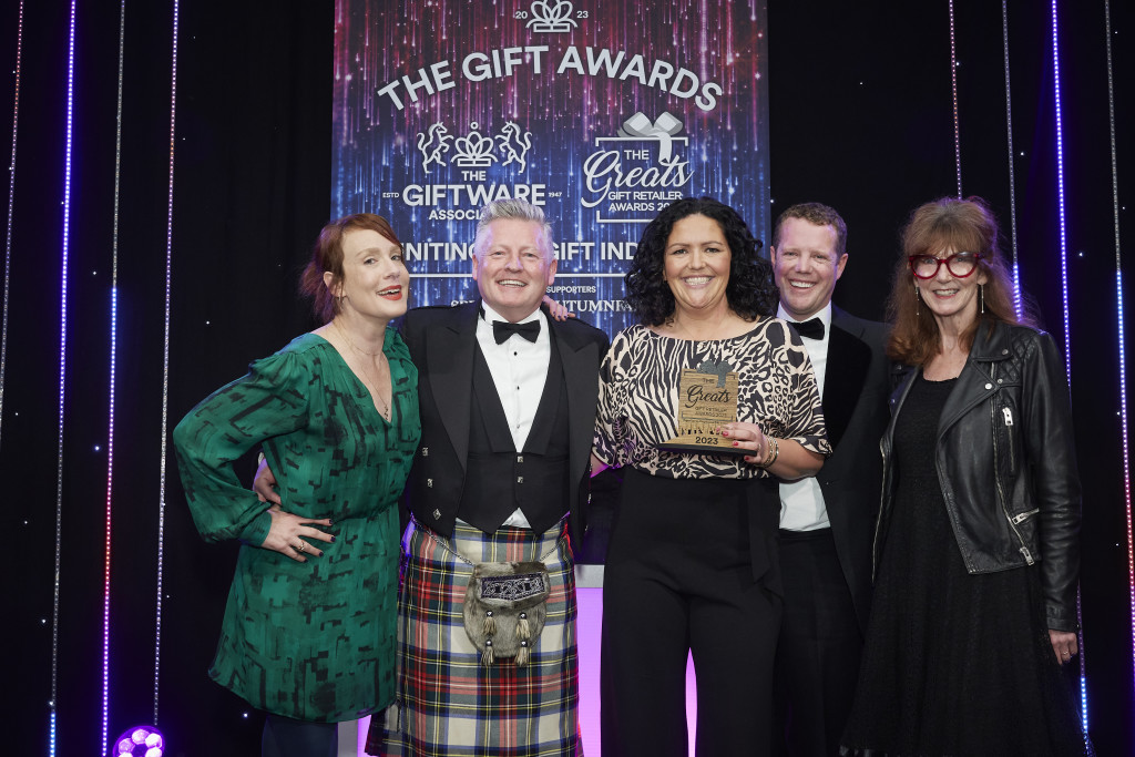Above: David Lorimer (left) and Kieron Cockley, co-owners of Brocante, together with visual merchandiser Katy Warnes, received their Greats trophy from Lou Hunt, sales representative at Gisela Graham, category sponsor. Comedian and Awards compere Sara Barron is shown on the left.