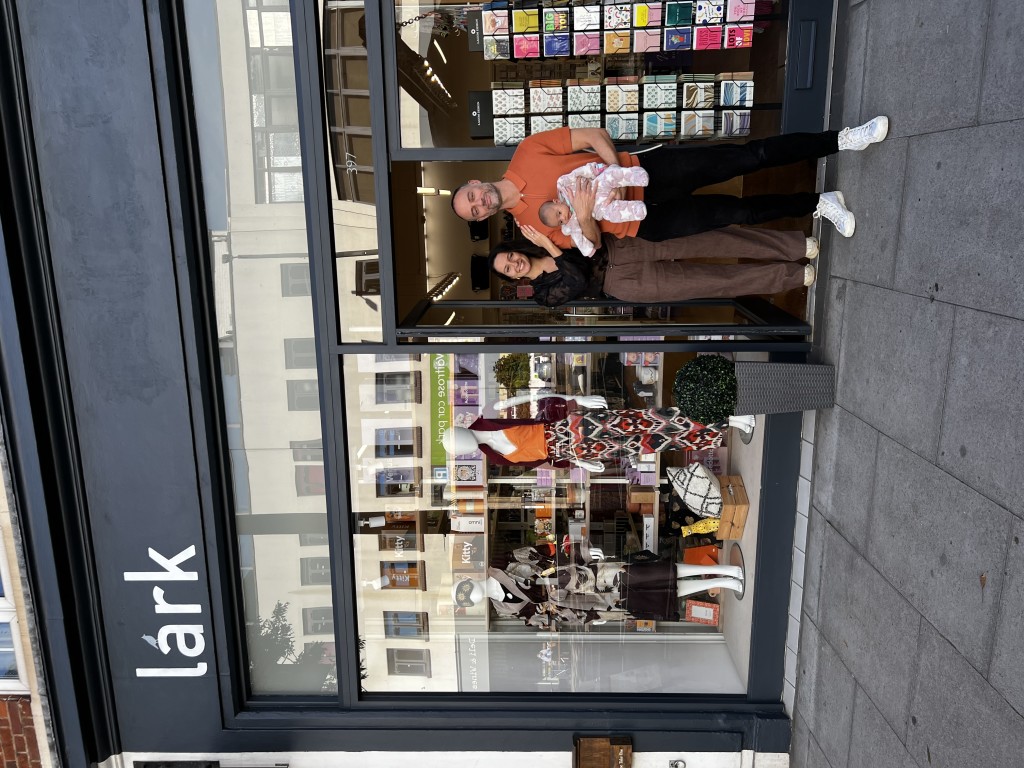 Above: Priya and Dom Aurora-Crowe are shown with baby Celine outside the recently opened Lark store in East Sheen.