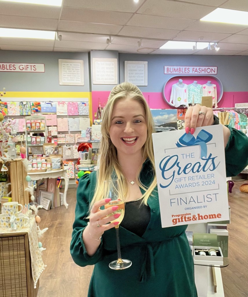 Alice Milner, manager of Bumbles in Ashtead, is shown celebrating the shop’s success as a Greats finalist.