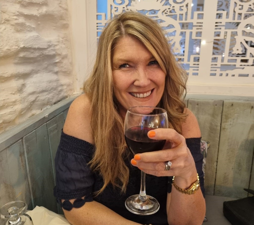 Above: Hugs & Kisses’ Caroline Ranwell enjoys a celebratory glass of wine.