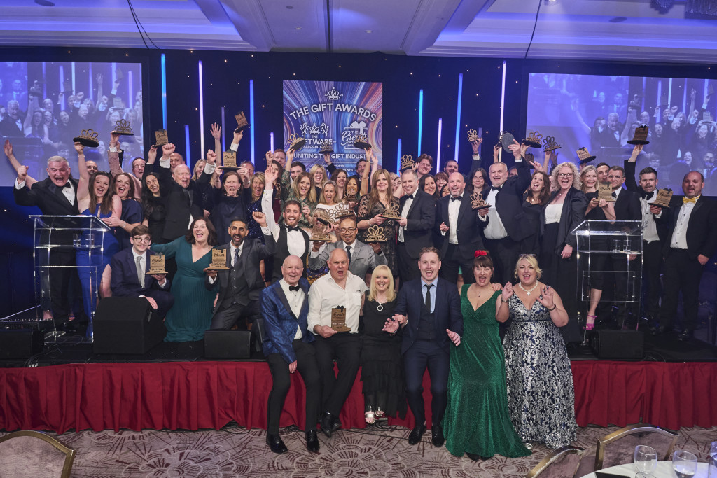 Above: We’ve won! Big smiles from the delighted winners of both The Greats Awards and The Gift of the Year Awards who are shown on stage with their trophies.